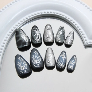 Dark gothic almond press-on nails with silver 3D liquid metal relief and glitter accents