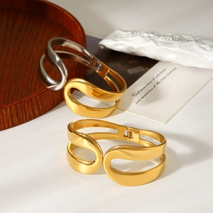 Minimalist two-tone stainless steel open bangle with a sleek wide streamline geometry design