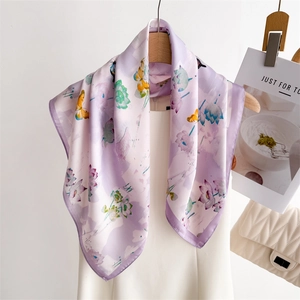 Elegant lavender silk scarf with butterfly and floral print hanging on a hanger