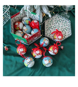Christmas ornaments set featuring Santa and reindeer on green velvet with a luxury gift box
