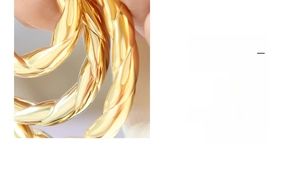 Macro shot of 18k gold plated hollow twisted rope pattern on French style earrings