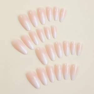 Glossy almond ombre press-on nails in nude pink and white with subtle mesh texture