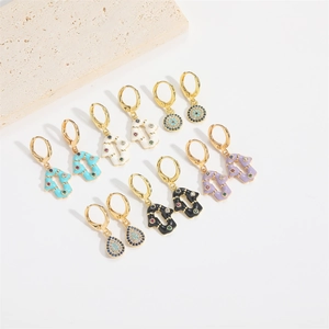 Chic gold hamsa and evil eye dangle earrings set with colorful enamel and zircons