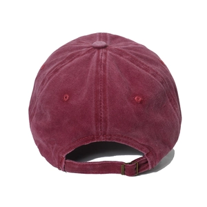 Detail view of burgundy washed cotton baseball cap featuring adjustable metal buckle