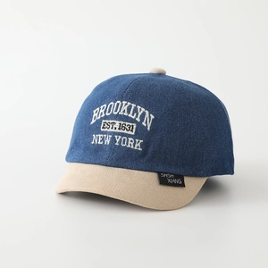 Close-up of Brooklyn 1631 embroidery on colorblock denim kids baseball cap