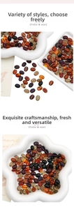 Detailed view of coffee bean acrylic beads with gold textures in white ceramic tray