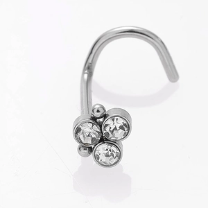 Macro view of silver curved nose stud featuring a sparkling three-zircon cluster design