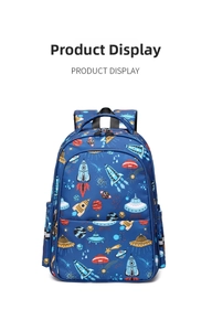 Close-up of waterproof school backpack featuring cartoon rocket and space print details
