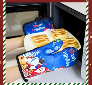 Blue heat resistant oven mitts with Santa pattern used to take food from microwave