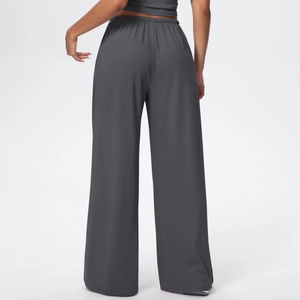 Rear view of dark grey wide-leg yoga pants showing elastic high waist and soft fabric