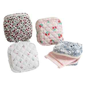 Quilted cotton organizer pouches set in floral and cherry prints with zipper closure