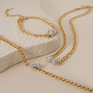Detailed view of 18k gold plated Cuban chain jewelry set with marquise-cut zircons