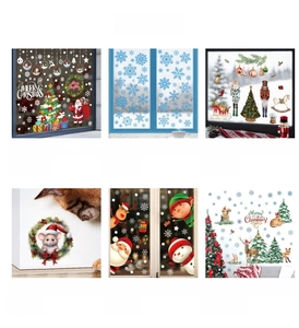 Detail showing various 3D Santa and reindeer PVC wall stickers for Christmas decor