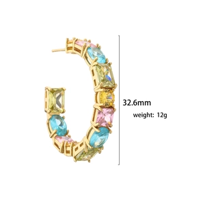 Golden C-shaped earrings with colorful zircon stones in pink blue and yellow