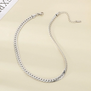 Detail of silver flat Cuban link necklace with lobster clasp and extension chain