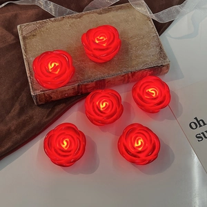 Set of 6 red artificial rose LED night lights creating a romantic atmosphere