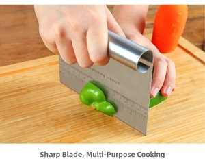 Action shot of stainless steel dough scraper with scale cutting vegetables on a wood board