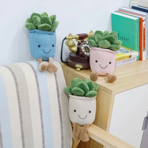 Three plush tulip succulents in colorful pots with cute faces for home decor