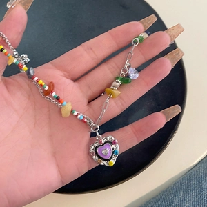 Layered heart pendant necklace with colorful beads and silver chain for women