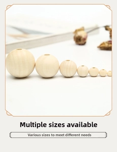 Detailed view of various sizes of natural unfinished smooth round wooden beads for DIY crafts