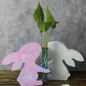 Detail of rabbit silicone mold with hydroponic test tube for floral arrangement