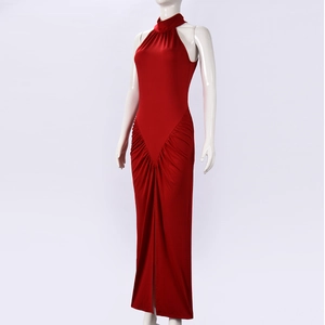 Detail of red halter neck dress featuring ruched waist design and high side slit