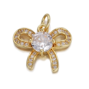 Macro shot of 18K gold butterfly pendant with sparkling clear pavé set crystals