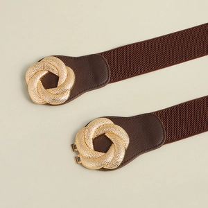 Close-up of brown elastic waist belt with gold interlocking metal buckle and leather ends