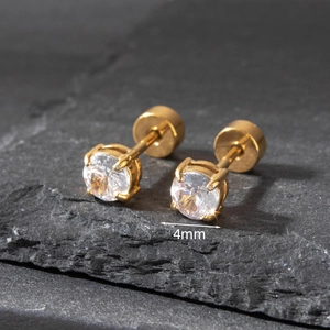 Detail view of 4mm round cubic zirconia stud earrings with gold screw back on stone