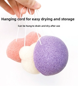 Detailed view of three biodegradable konjac facial sponges with convenient hanging ropes