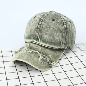 Vintage washed denim baseball cap with distressed frayed brim and 6-panel design