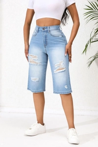 Full view of high waist distressed light blue denim shorts with ripped details for women