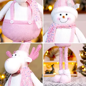 Pink Christmas plush doll with telescopic legs featuring snowman and reindeer designs