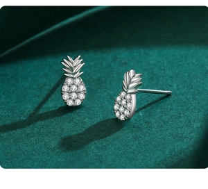 Macro view of S925 sterling silver pineapple stud earrings with micro-pave cubic zirconia