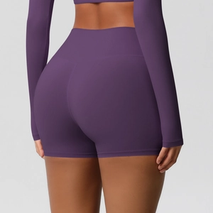 Rear view of high-waisted yoga shorts in deep purple featuring seamless scrunch butt detail