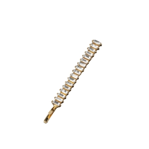 Elegant gold hair clip with channel-set baguette cut clear cubic zirconia stones