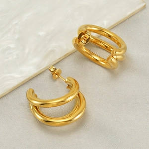 Chic 18k gold-plated titanium steel layered double hoop earrings on marble surface