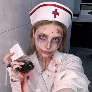 Close-up of white nurse hat with red cross and bloodstained sailor costume for cosplay