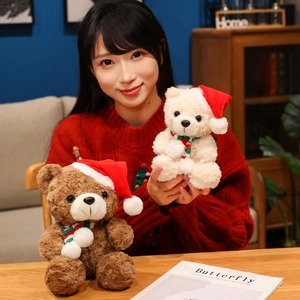 Plush Christmas teddy bears in brown and white with festive scarves and hats