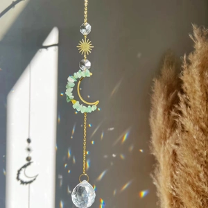 Golden moon sun catcher with amethyst stones and crystal ball creating rainbow light