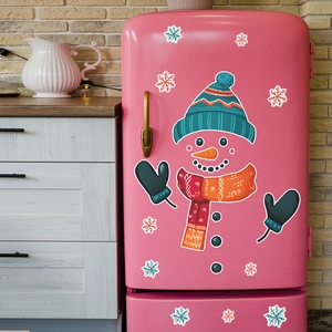 Cartoon snowman Christmas fridge magnets set with snowflakes on a pink vintage refrigerator