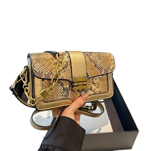 Fashion snake print crossbody bag with gold chain strap and vintage metal clasp