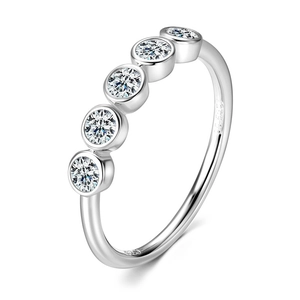 Macro shot of S925 sterling silver ring with five round sparkling moissanite stones