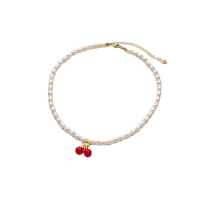 Elegant white freshwater pearl necklace with a red cherry pendant and gold clasp for women