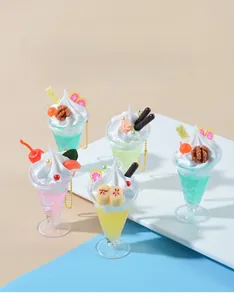 Detail view of colorful faux ice cream sundae pendants with cream and fruit toppings