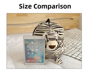Detailed size comparison of tiger print kids backpack next to an iPad on a white bed