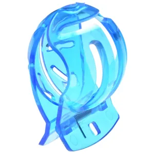 Close-up of translucent blue golf ball marker tool with a metal spring and hollow design