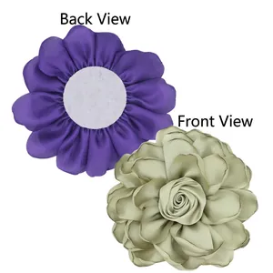 Handmade satin rose fabric flowers in purple and green showing front and back view