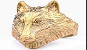 Detailed view of the vintage golden viking wolf head ring with intricate metallic textures