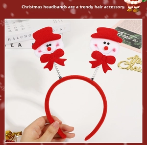 Detail of Christmas headband with snowmen on springs and festive red fabric wrap